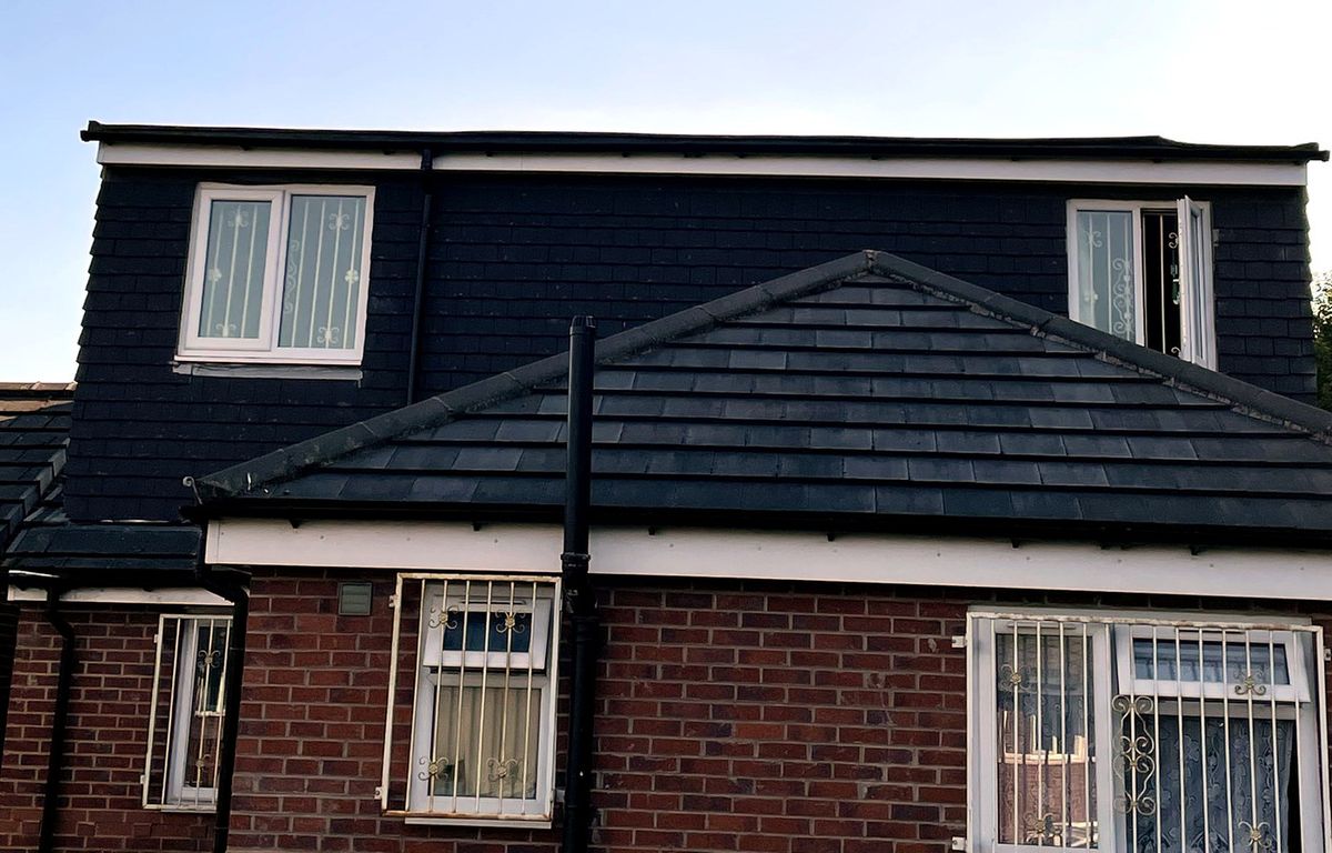 Loft dormer conversion, slate-grey tile-hung finish