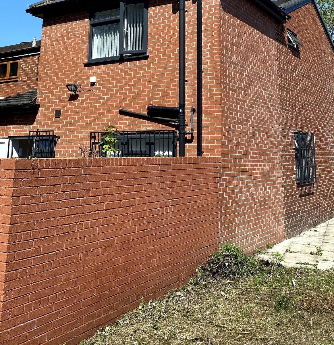Corner elevation of a single-storey brick extension